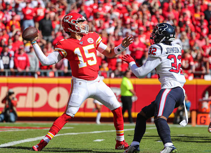 Oct 13, 2019; Kansas City, MO, USA; Kansas City Chiefs quarterback Patrick Mahomes (15) throws a pass as Houston Texans cornerback Lonnie Johnson (32) defends during the first half at Arrowhead Stadium. Mandatory Credit: Jay Biggerstaff-USA TODAY Sports